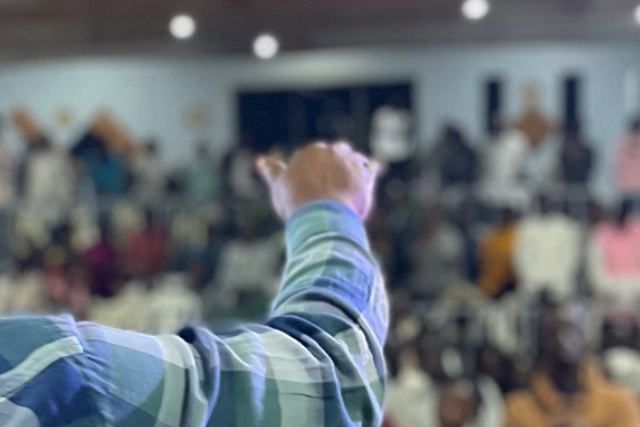 Diverse congregation at Revival Palace Community Church during Sunday service